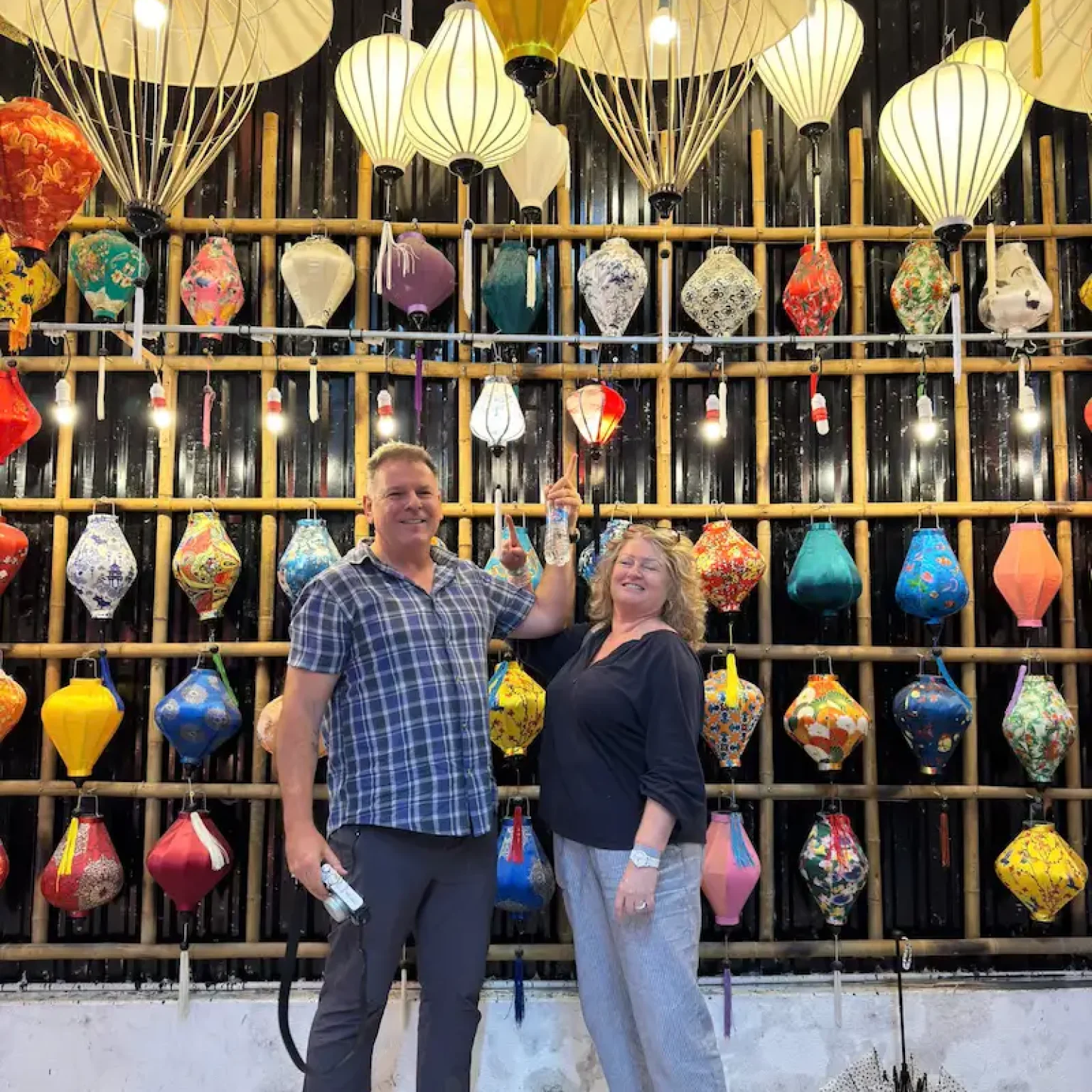 Couple visiting local lantern shop in Hoi An during Da Nang tours