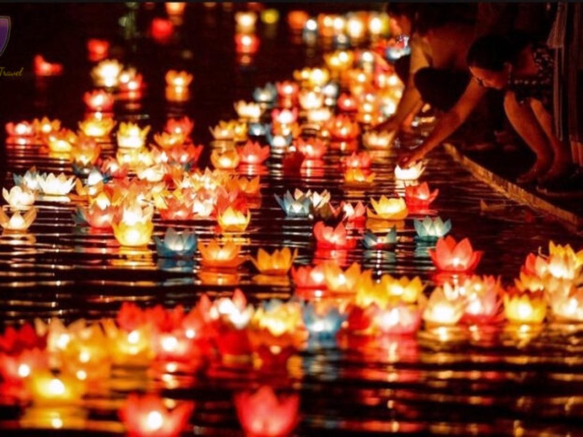 people releasing floating lanterns
