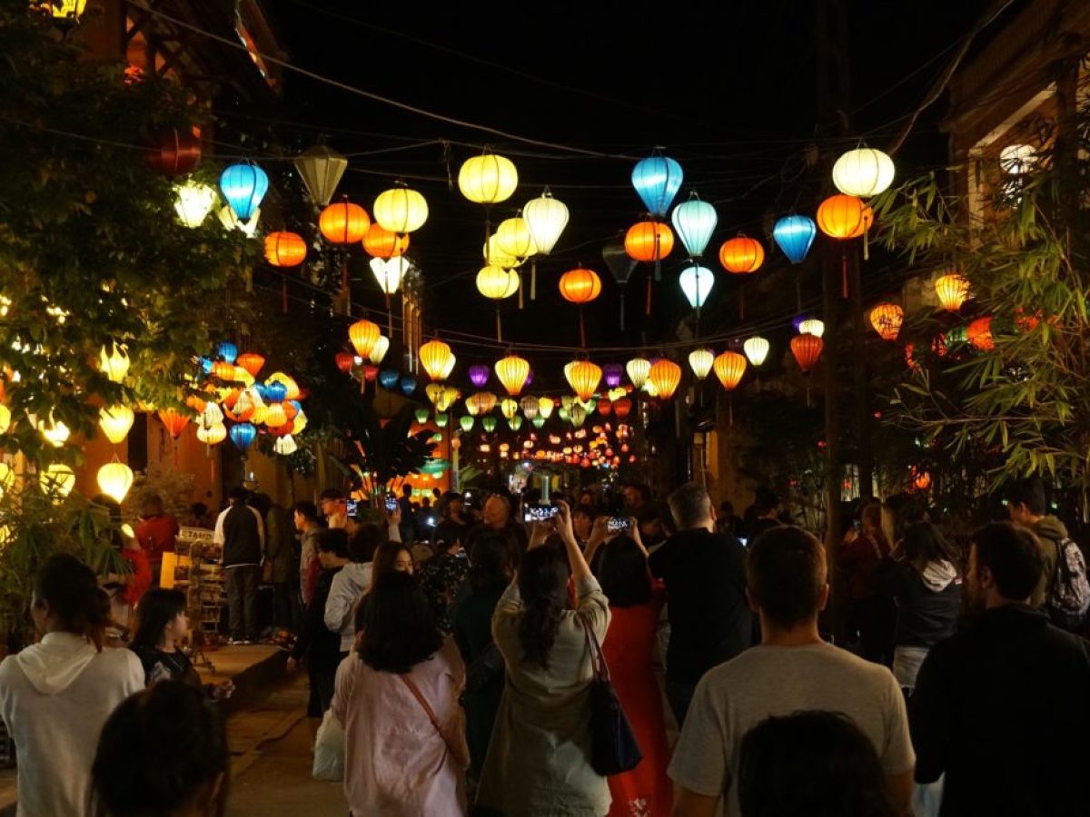 traveller taking a walk through lantern street at night
